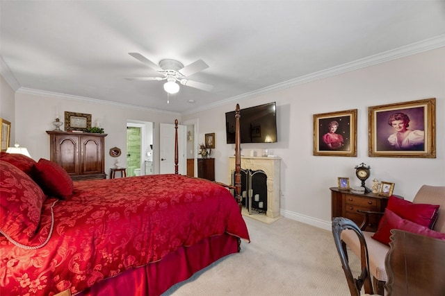 carpeted bedroom featuring crown molding, a ceiling fan, baseboards, and a fireplace