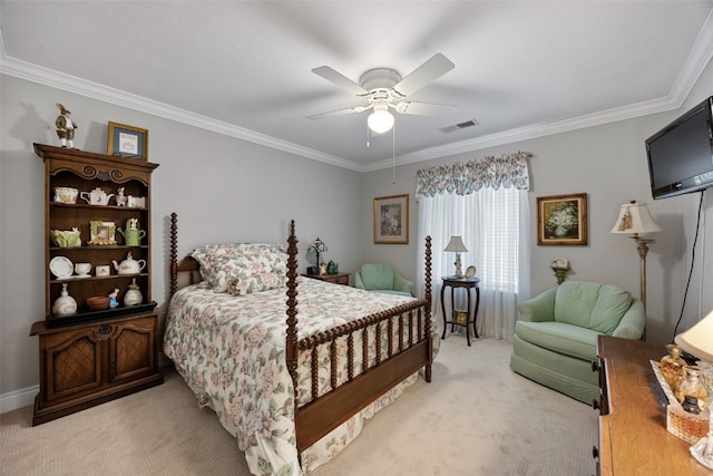 bedroom with crown molding, ceiling fan, visible vents, and light carpet