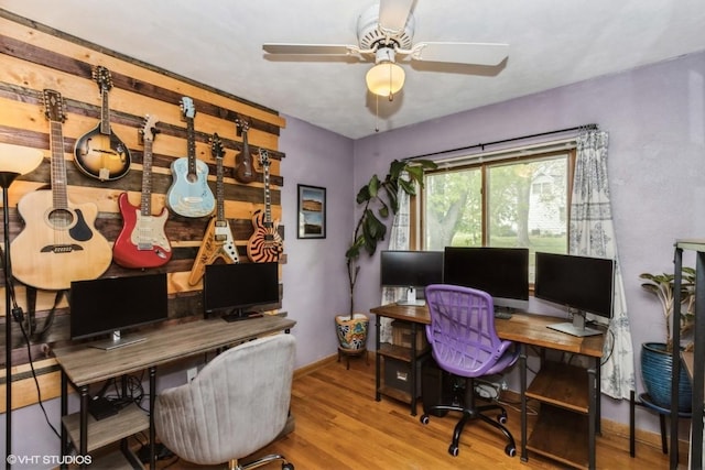 home office with baseboards, ceiling fan, and wood finished floors