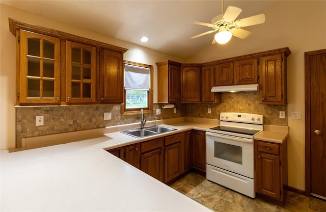 kitchen featuring glass insert cabinets, white electric range oven, under cabinet range hood, a sink, and backsplash