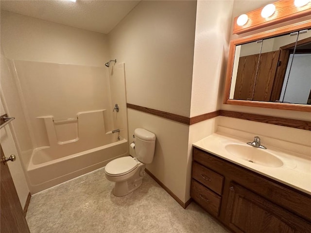 bathroom with vanity, toilet, baseboards, a textured ceiling, and shower / bath combination