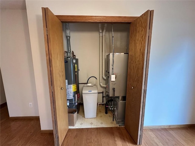 utility room with gas water heater