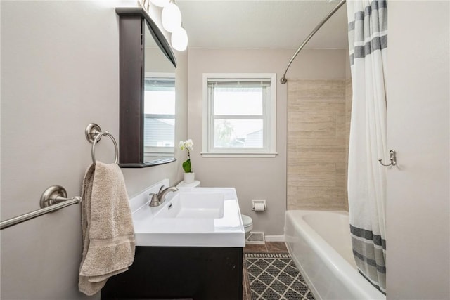 full bathroom featuring shower / bath combination with curtain, tile patterned flooring, vanity, baseboards, and toilet