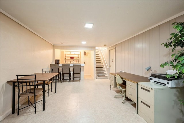 office space featuring crown molding and light floors