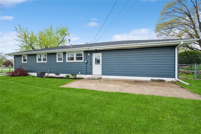 rear view of property featuring a patio area, fence, a yard, and cooling unit