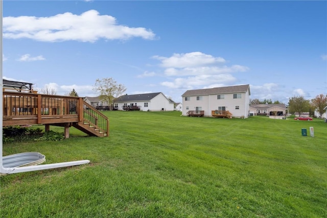 view of yard featuring stairway and a wooden deck