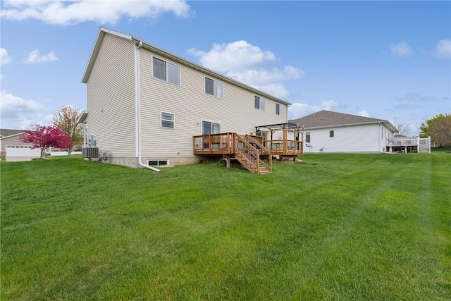 back of house featuring a lawn, a pergola, central AC, and a deck