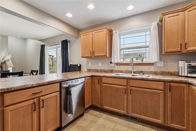 kitchen with recessed lighting, a sink, dishwasher, and a wealth of natural light