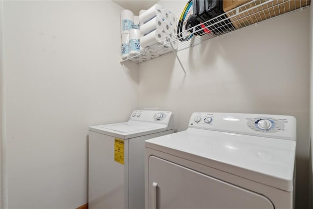 clothes washing area with laundry area and independent washer and dryer