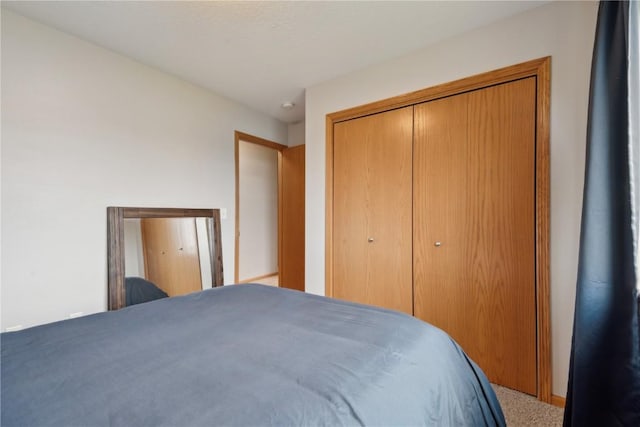 bedroom featuring a closet and carpet floors
