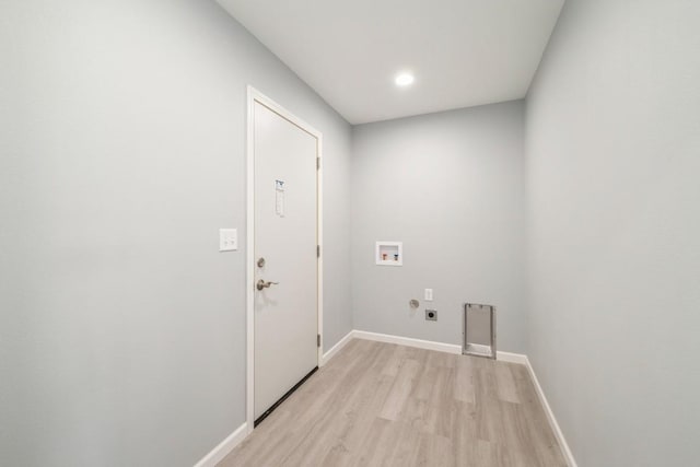 laundry area featuring laundry area, light wood-style floors, baseboards, washer hookup, and hookup for an electric dryer