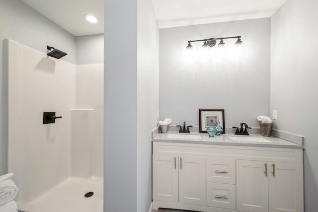 full bathroom featuring a sink and a walk in shower