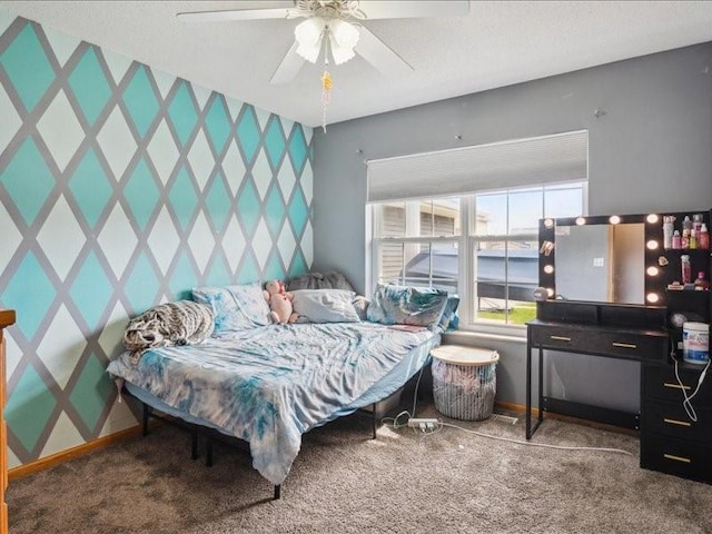 bedroom with baseboards, a ceiling fan, and carpet
