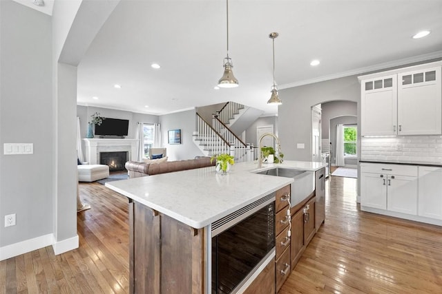 917 Robin Rd, Iowa City, IA 52246 - kitchen featuring arched walkways, a wealth of natural light, appliances with stainless steel finishes, and a sink