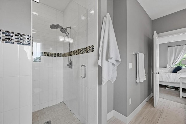 917 Robin Rd, Iowa City, IA 52246 - ensuite bathroom with a stall shower, ensuite bath, and baseboards
