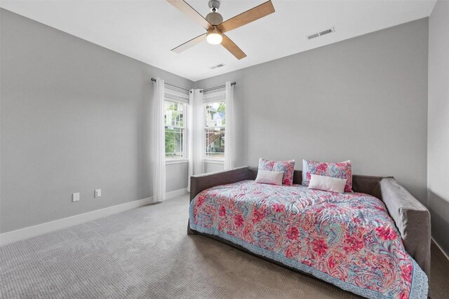 917 Robin Rd, Iowa City, IA 52246 - carpeted bedroom featuring baseboards, a ceiling fan, and visible vents