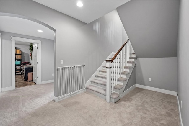 917 Robin Rd, Iowa City, IA 52246 - stairway featuring carpet, arched walkways, baseboards, and recessed lighting
