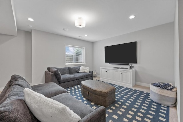 917 Robin Rd, Iowa City, IA 52246 - carpeted living room featuring baseboards and recessed lighting