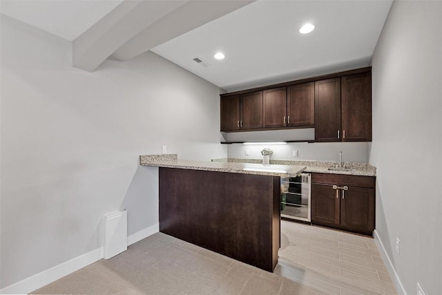 917 Robin Rd, Iowa City, IA 52246 - kitchen featuring a sink, wine cooler, visible vents, recessed lighting, and dark brown cabinetry
