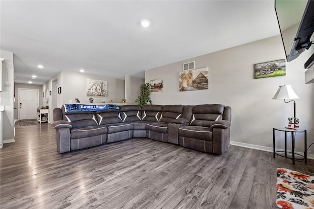 living room with baseboards, recessed lighting, visible vents, and wood finished floors