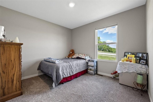 carpeted bedroom with baseboards