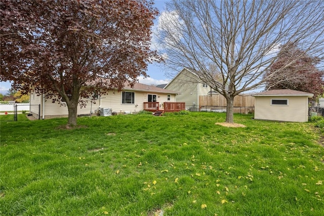 3325 29th Ave, Marion, IA 52302 - view of yard with cooling unit, a wooden deck, and a fenced backyard