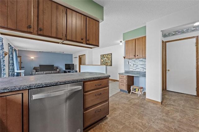 3325 29th Ave, Marion, IA 52302 - kitchen featuring brown cabinets, decorative backsplash, and stainless steel dishwasher