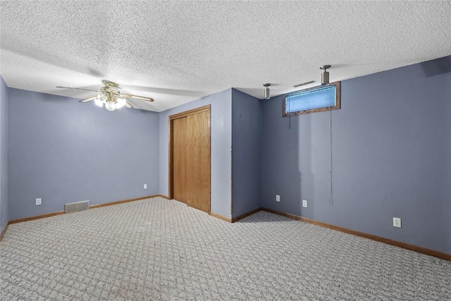 3325 29th Ave, Marion, IA 52302 - empty room with carpet, visible vents, baseboards, and ceiling fan