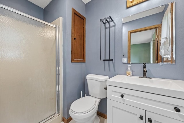 3325 29th Ave, Marion, IA 52302 - full bathroom with vanity, toilet, baseboards, and a stall shower
