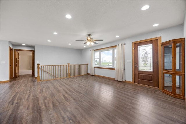 foyer with wood finished floors, baseboards, and recessed lighting