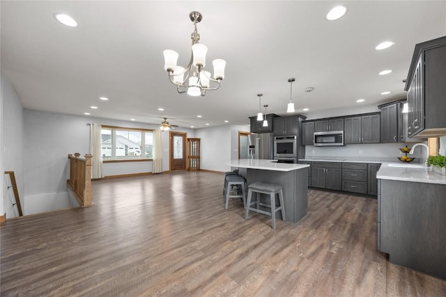 kitchen featuring light countertops, stainless steel appliances, and recessed lighting