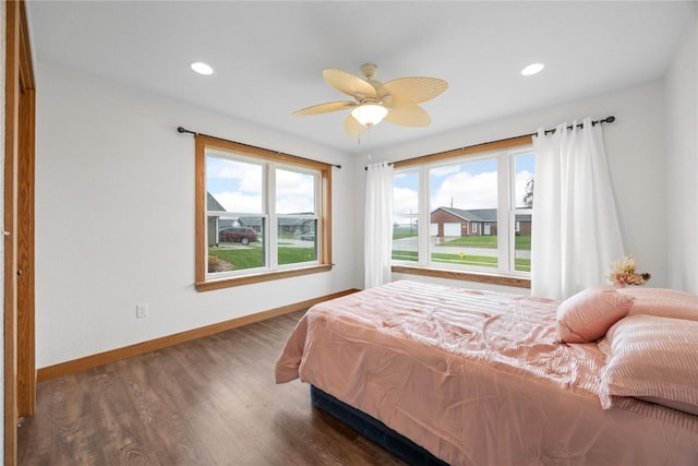 bedroom featuring wood finished floors, baseboards, ceiling fan, and recessed lighting