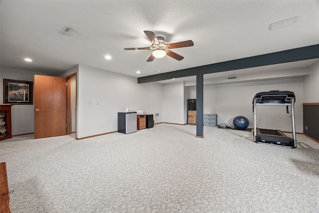 interior space with baseboards, carpet, visible vents, and a ceiling fan