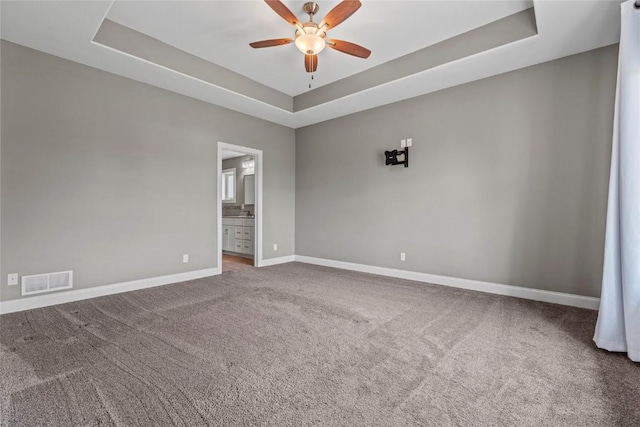 4332 Quail Trail Dr, Marion, IA 52302 - carpeted empty room with a tray ceiling, a ceiling fan, and baseboards