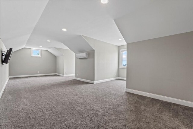 4332 Quail Trail Dr, Marion, IA 52302 - additional living space featuring a wall mounted air conditioner, lofted ceiling, carpet, baseboards, and recessed lighting
