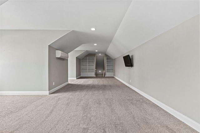 4332 Quail Trail Dr, Marion, IA 52302 - additional living space featuring a wall mounted air conditioner, lofted ceiling, baseboards, carpet floors, and built in features