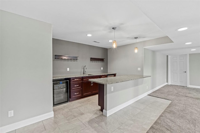 4332 Quail Trail Dr, Marion, IA 52302 - kitchen featuring beverage cooler, a sink, baseboards, recessed lighting, and hanging light fixtures