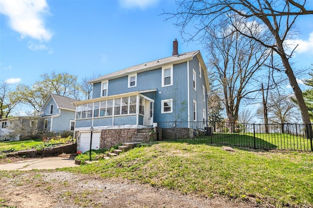 back of property featuring a chimney, fence, a garage, a sunroom, and concrete driveway