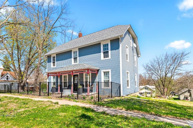 133 N 5th St, West Branch, IA 52358 - rear view of house featuring a chimney and a patio