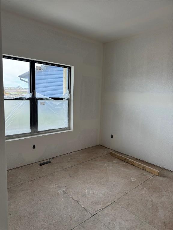 spare room featuring visible vents