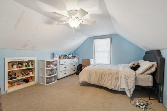 bedroom with ceiling fan, light colored carpet, and vaulted ceiling