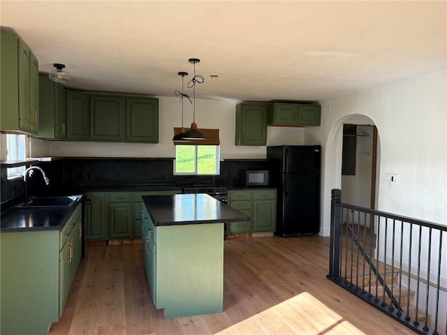 22101 Pleasant Dr, Bernard, IA 52032 - kitchen with green cabinets, black appliances, a sink, and dark countertops