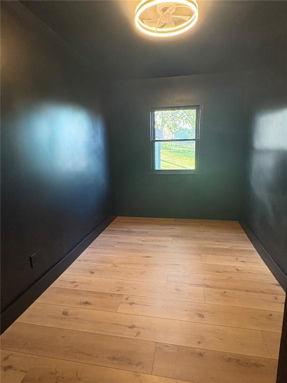 22101 Pleasant Dr, Bernard, IA 52032 - spare room with wood finished floors