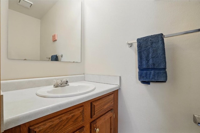 bathroom featuring visible vents and vanity