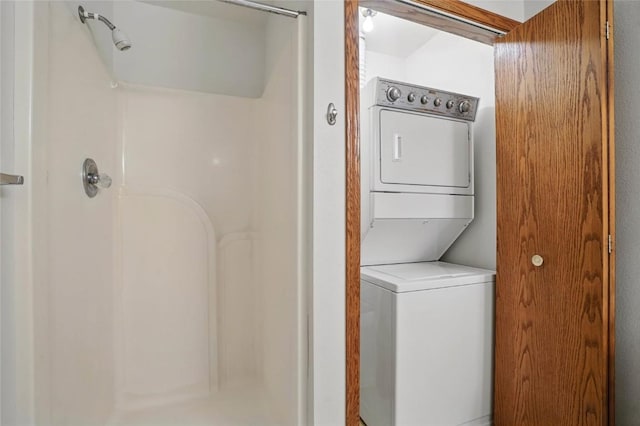 laundry room featuring stacked washer and clothes dryer and laundry area