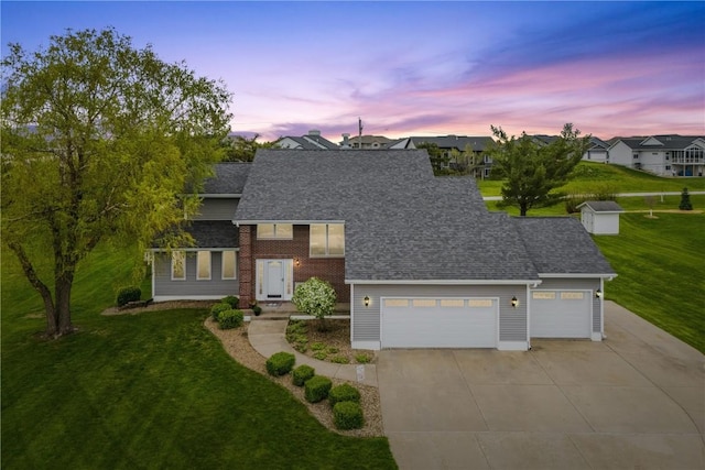 4199 Brookside Dr, Marion, IA 52302 - traditional-style home featuring driveway, a shingled roof, a front lawn, and a garage