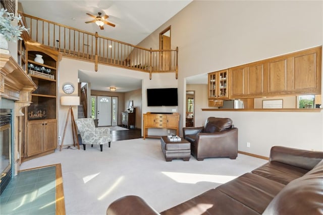 4199 Brookside Dr, Marion, IA 52302 - carpeted living room with a ceiling fan, baseboards, and a high ceiling
