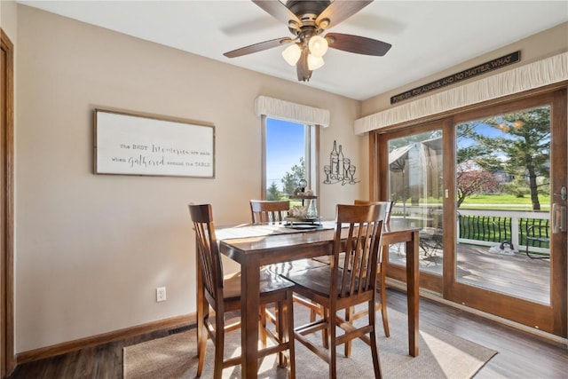 4199 Brookside Dr, Marion, IA 52302 - dining area with wood finished floors, baseboards, and ceiling fan