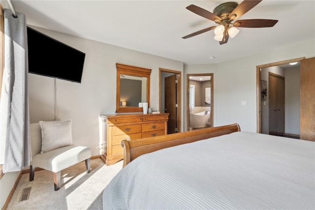 4199 Brookside Dr, Marion, IA 52302 - carpeted bedroom with connected bathroom, visible vents, baseboards, and ceiling fan