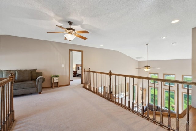 4199 Brookside Dr, Marion, IA 52302 - living area with vaulted ceiling, ceiling fan, carpet flooring, and recessed lighting